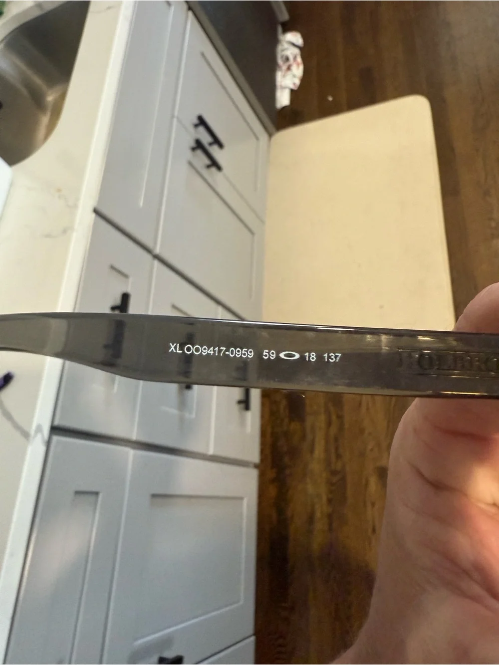 Oakley Black Frame Sunglasses with Blue Mirrored Lenses